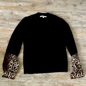 A Veronica Beard Cashmere V-neck cheetah print sweater.